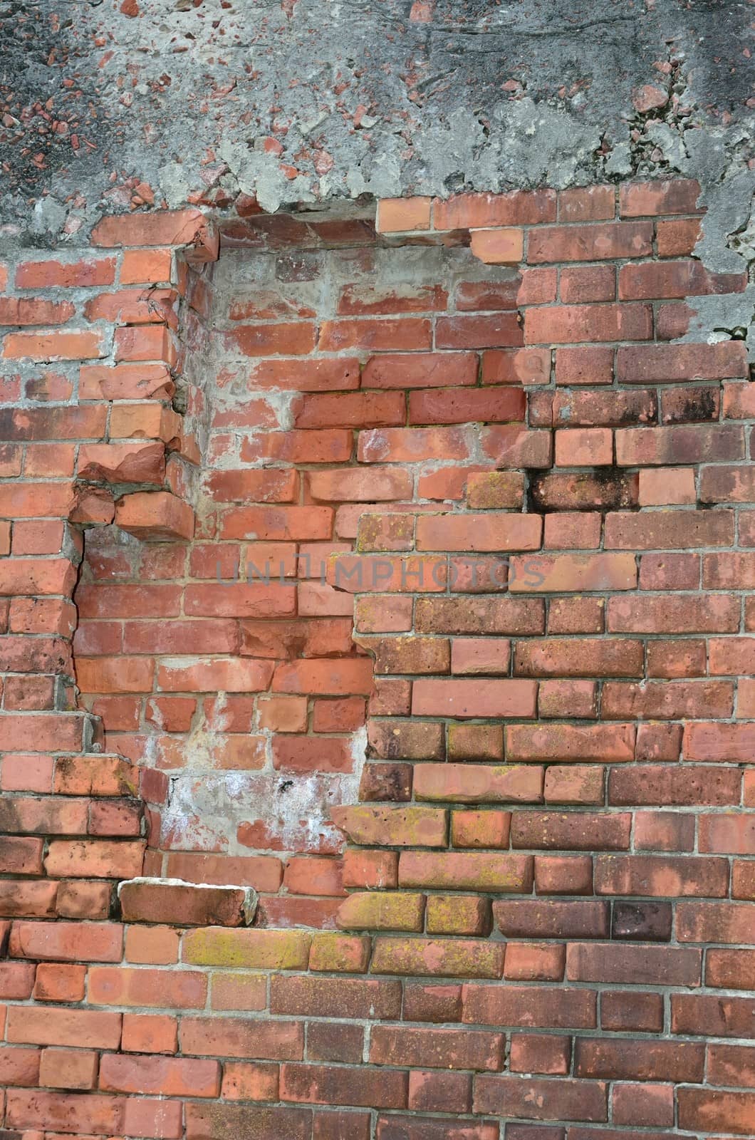 One layer of two layers of brick beginning to fall out in an old fort wall