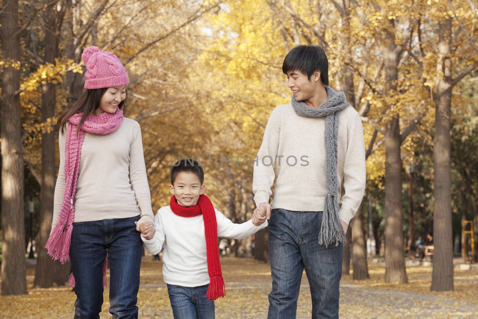 Happy Family in the Park in Autumn