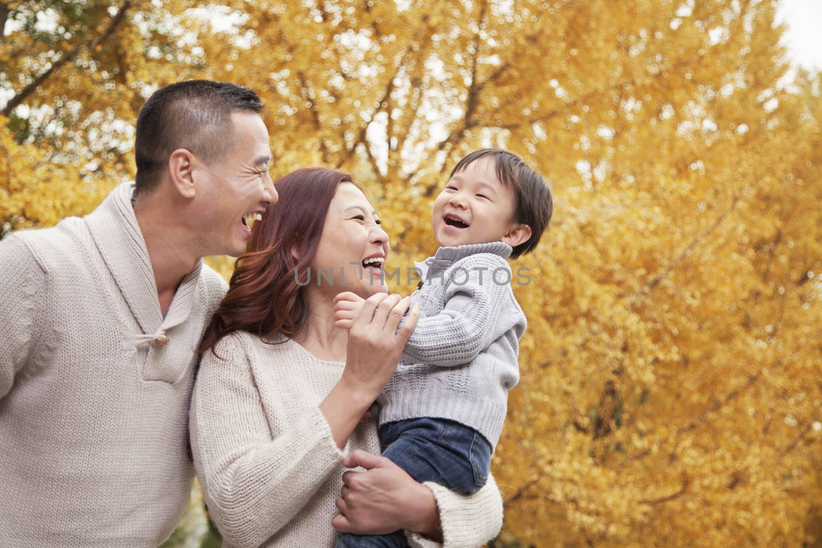 Family Enjoying a Park in Autumn by XiXinXing