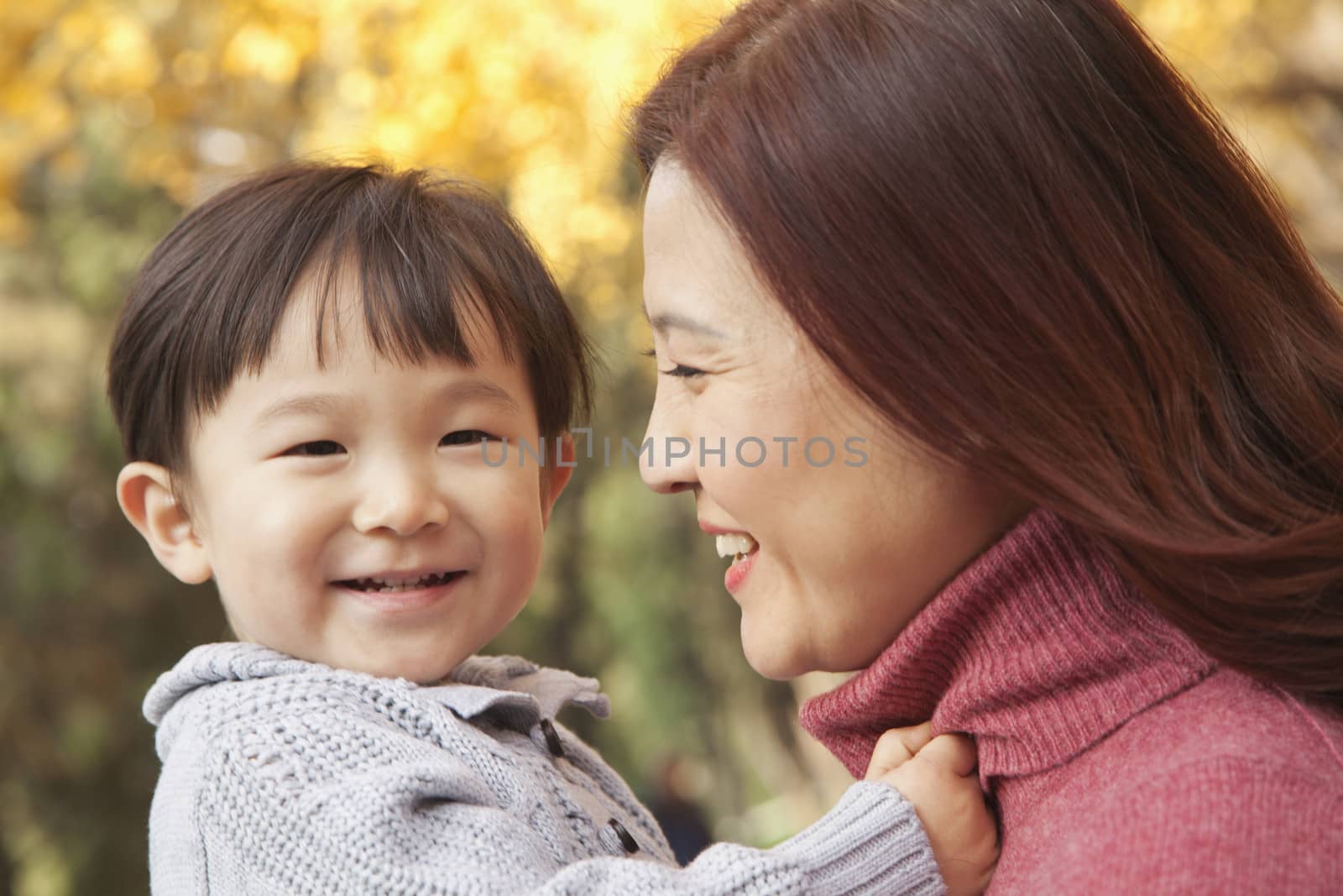 Mother and Son Enjoying a Park in Autumn by XiXinXing