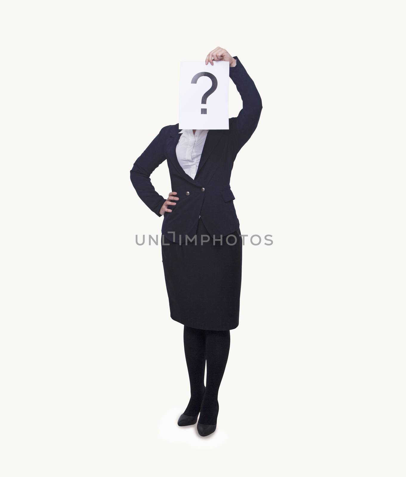 Young businesswoman holding at paper with a question mark on it, obscured face, studio shot