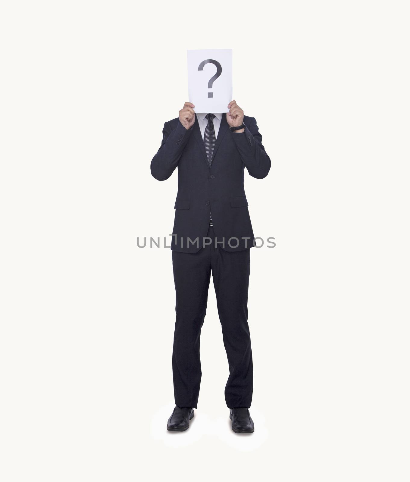 Young businessman holding at paper with a question mark on it, obscured face, studio shot by XiXinXing