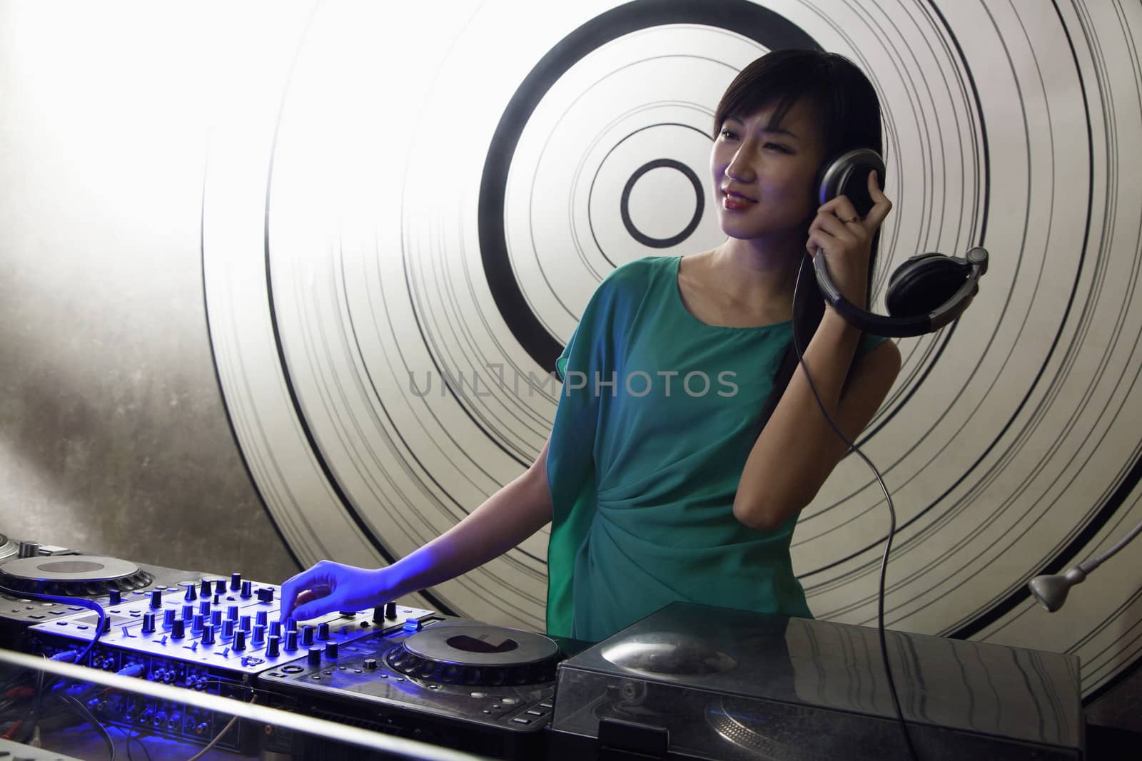 A portrait of a female DJ playing music in a nightclub by XiXinXing