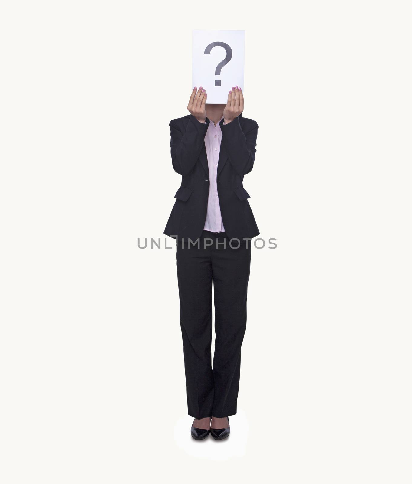 Young businesswoman holding at paper with a question mark on it, obscured face, studio shot