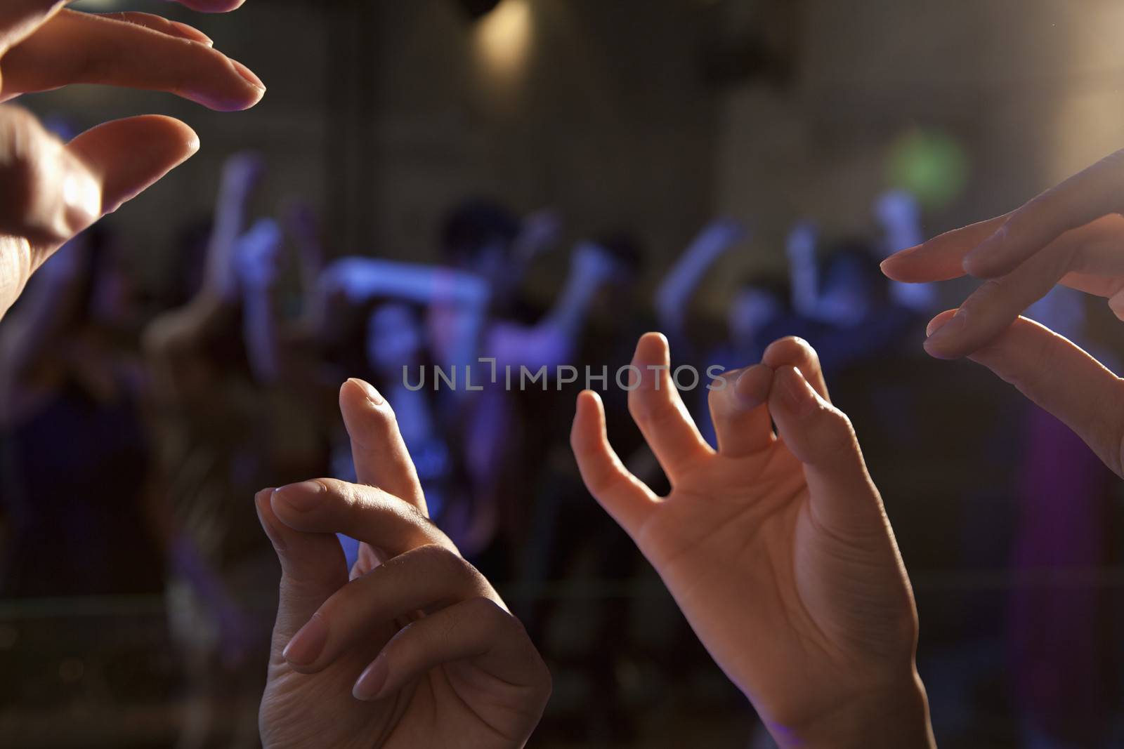 Close-up of hands in nightclub