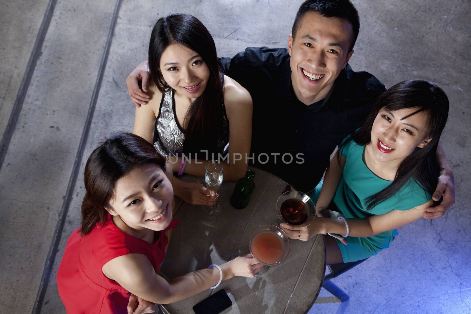 A group of friends having drinks in nightclub