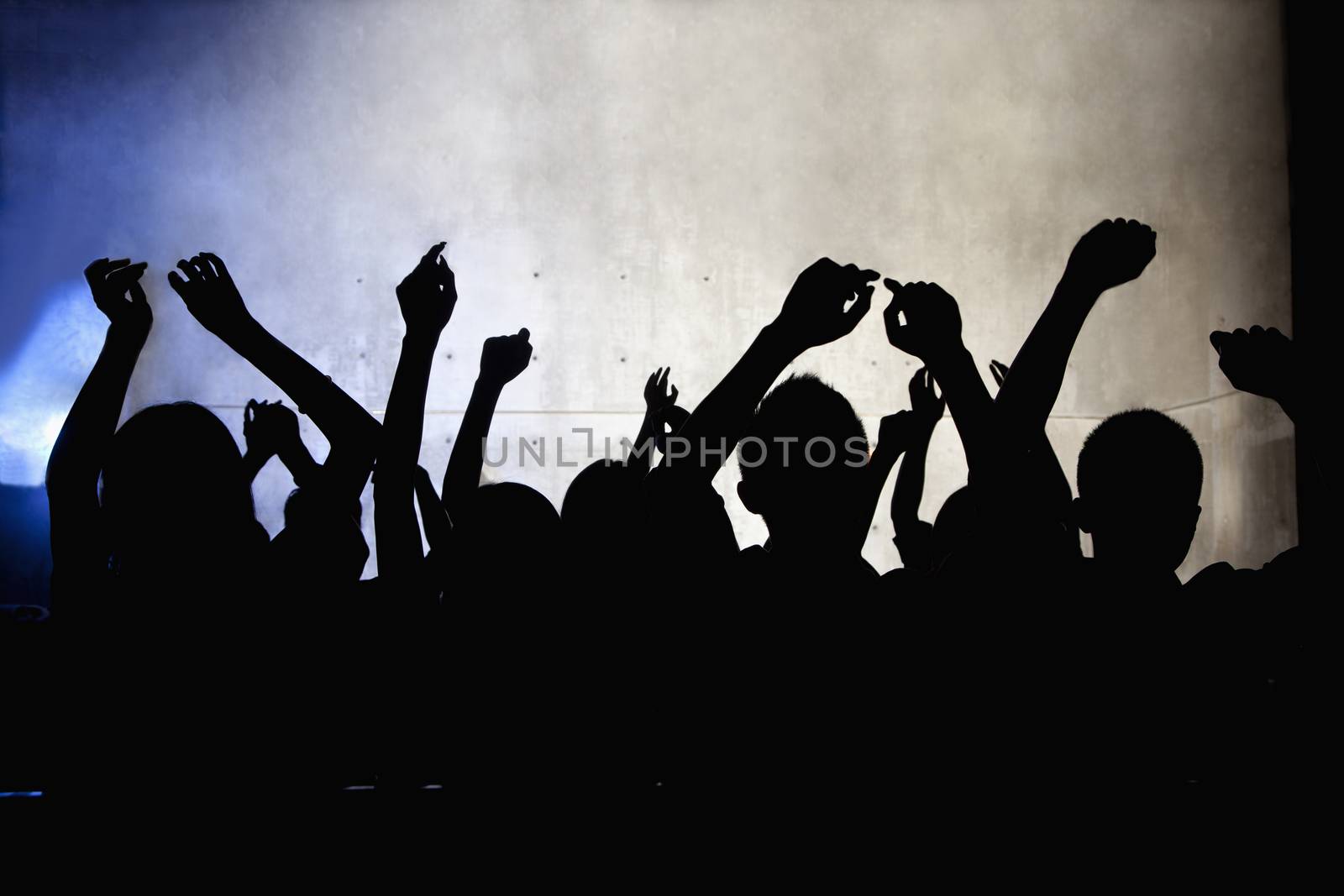 A crowd of young people dancing in a nightclub