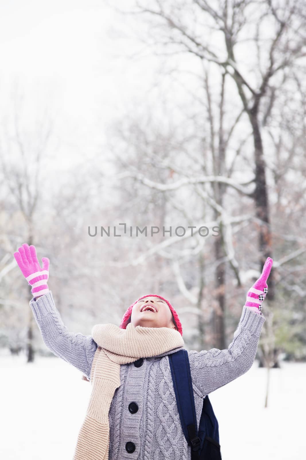 Girl playing in snow by XiXinXing