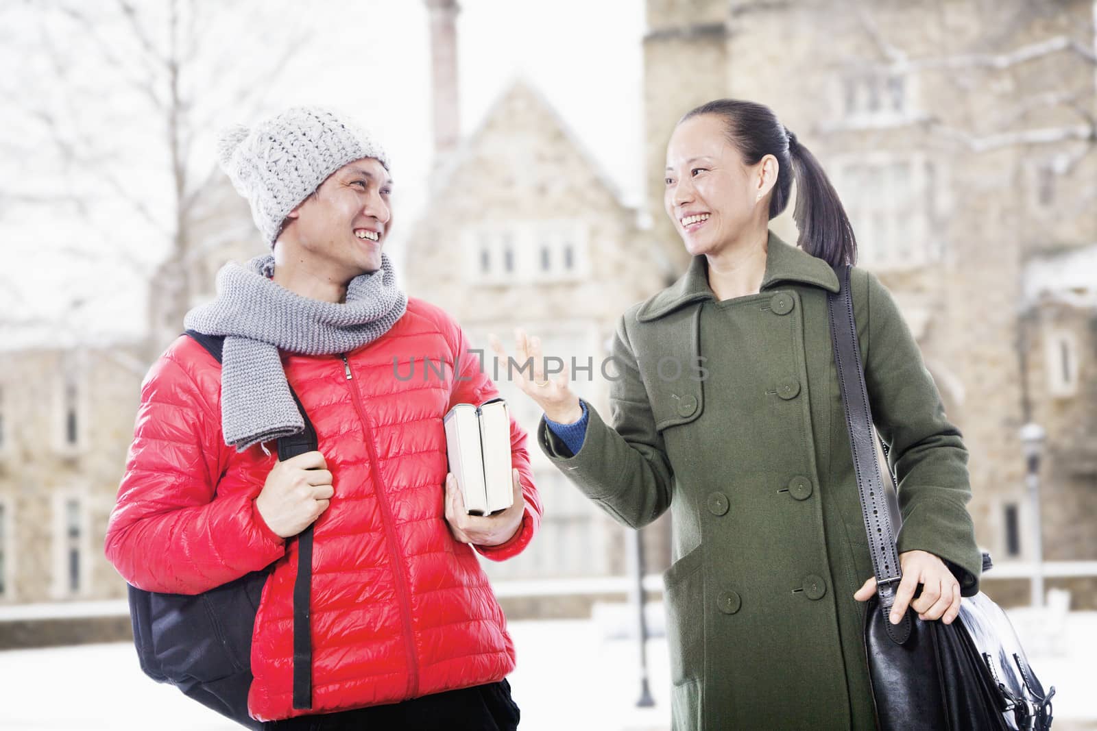 Smiling man and woman in winter clothes