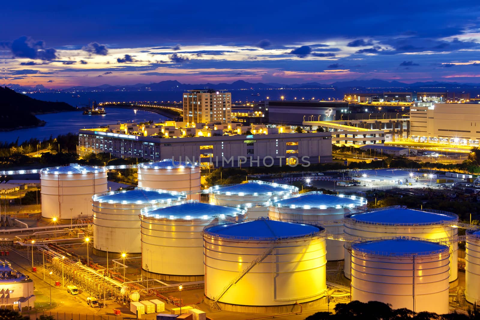 Oil tank at sunset in Hong Kong by kawing921