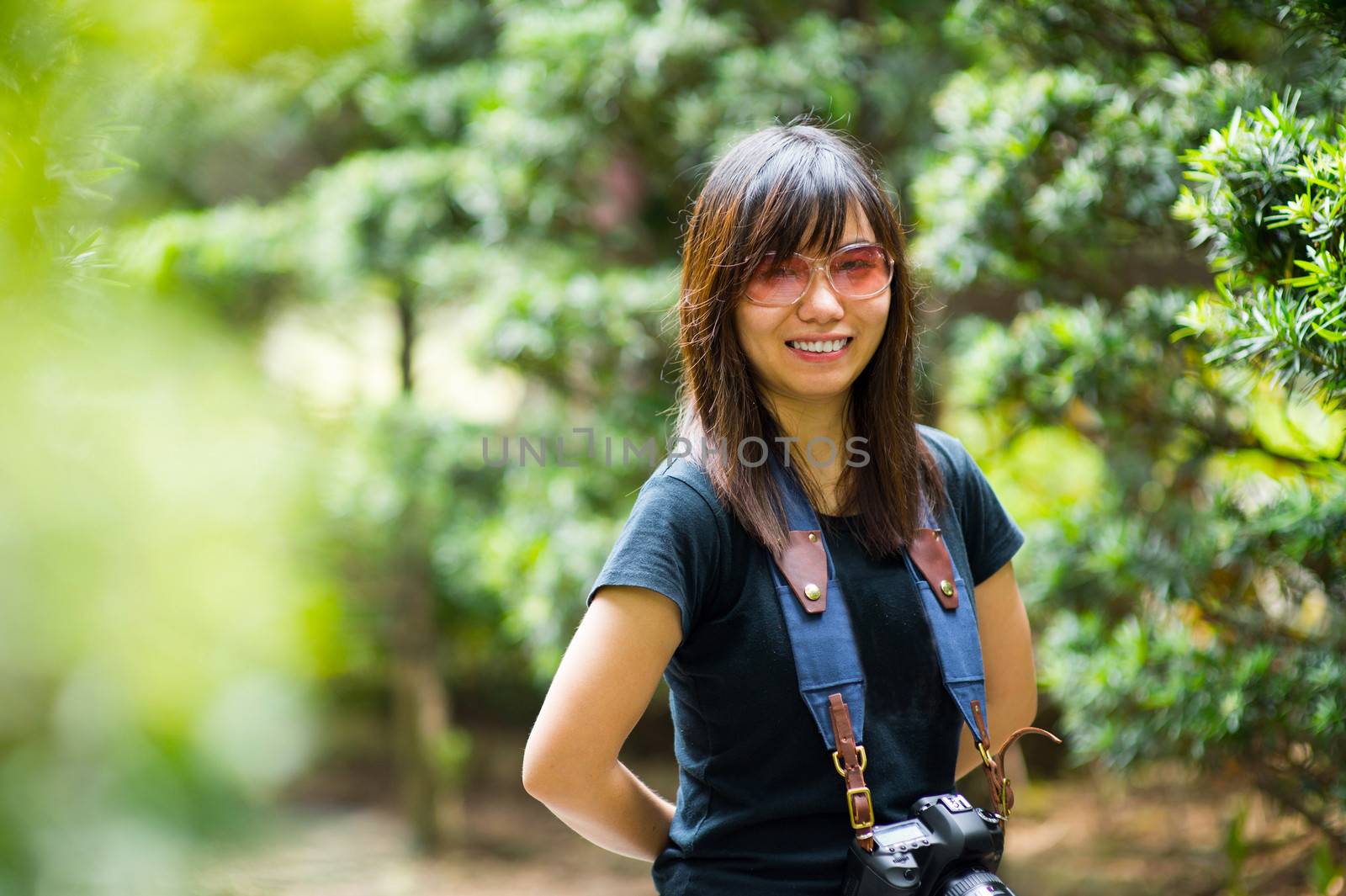 Asian woman photographer in nature by kawing921