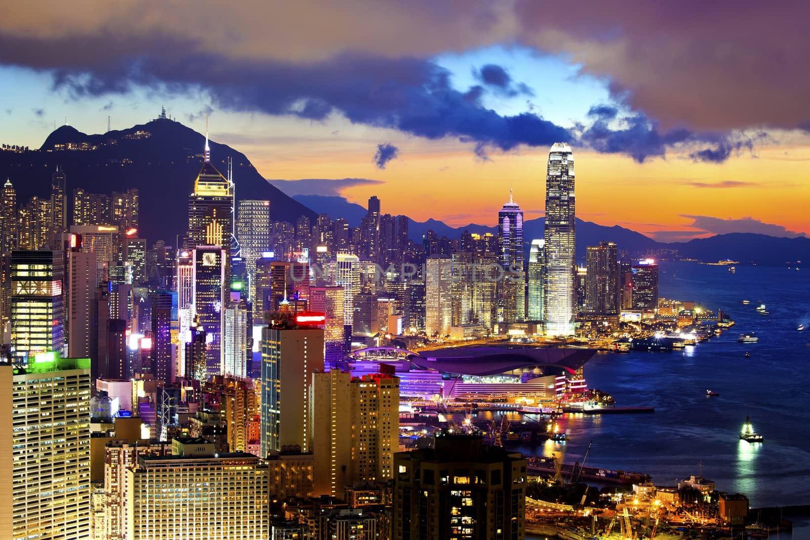 Crowded downtown and building in Hong Kong at sunset