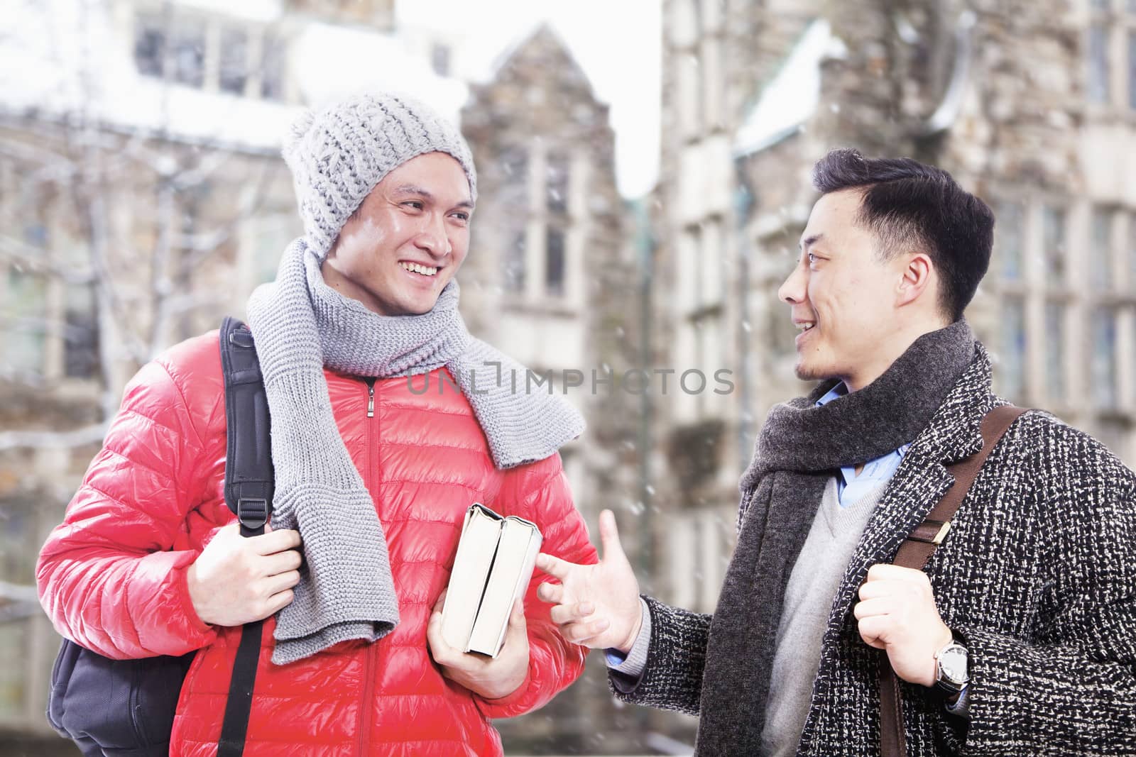 Two men in winter clothes talking