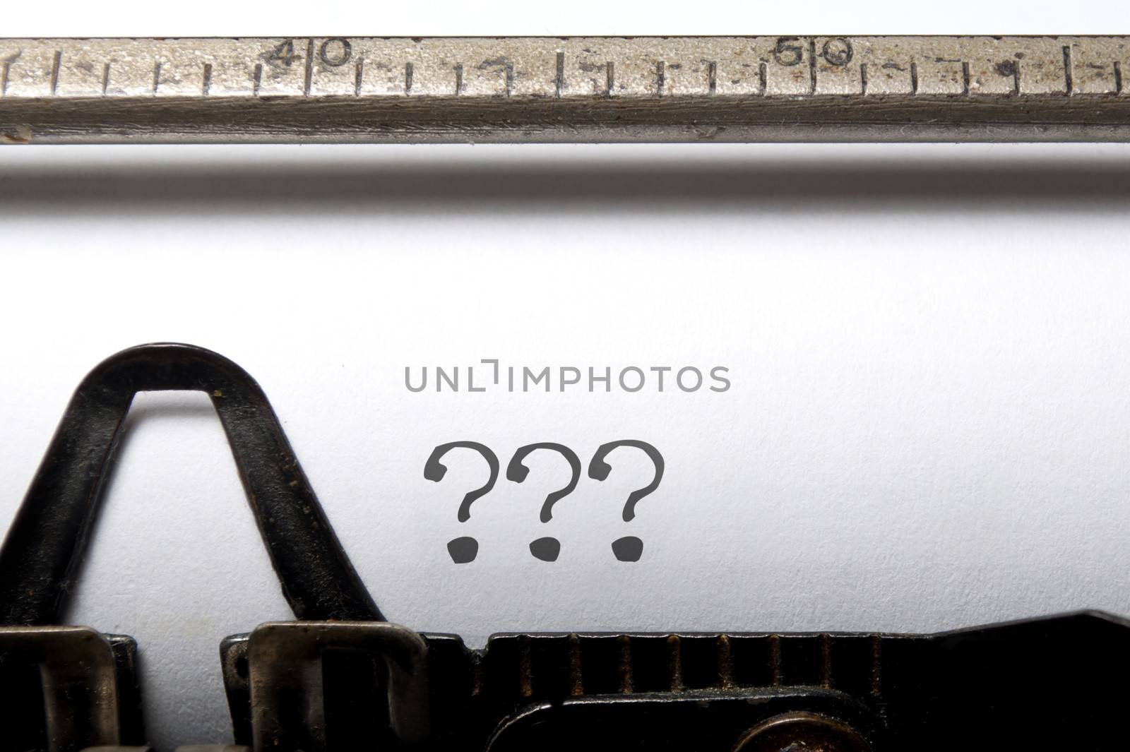 Three question marks printed on a typewriter 