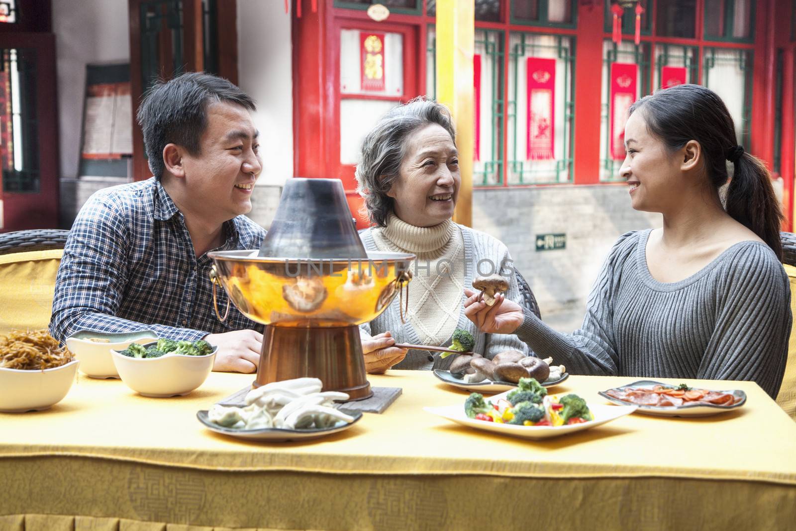 Family enjoying traditional Chinese meal