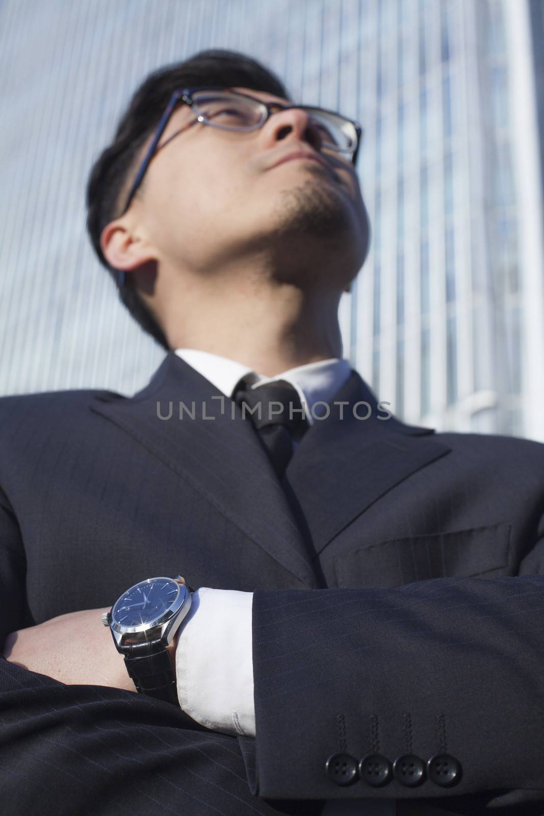 Portrait of businessman by the world trade center in Beijing, China by XiXinXing