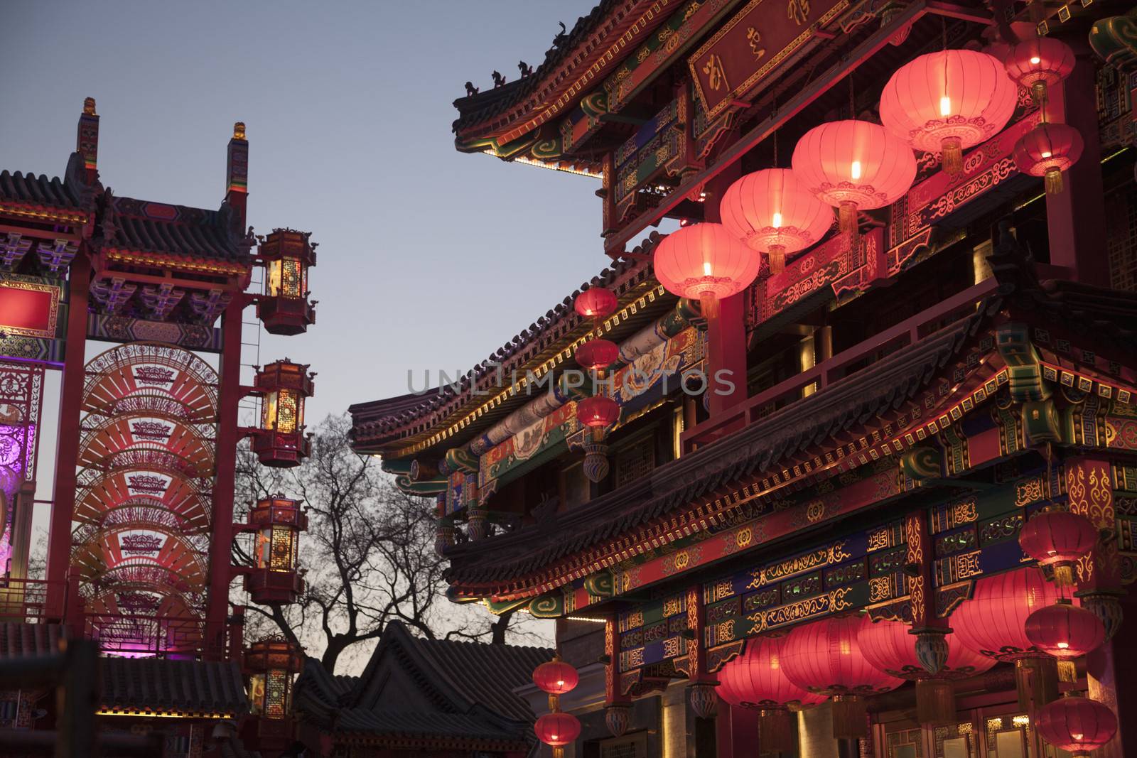 Traditional Chinese buildings illuminated at dusk in Beijing, China