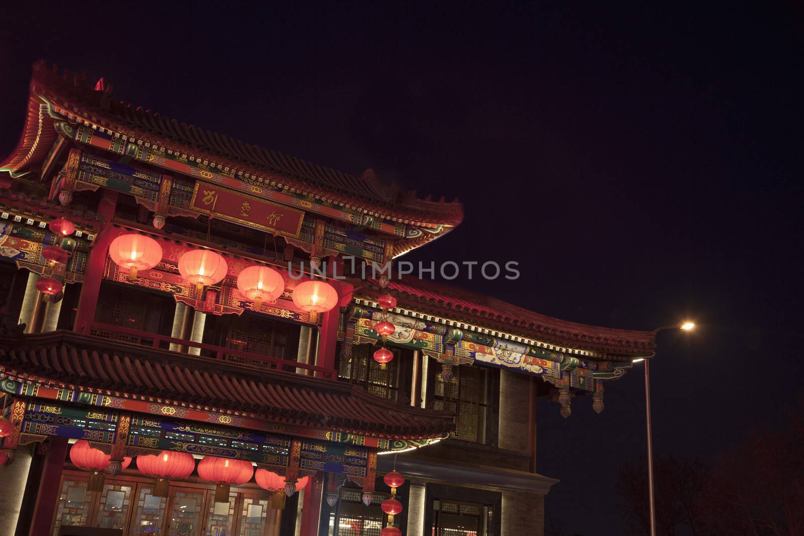 Traditional Chinese building illuminated at night in Beijing, China