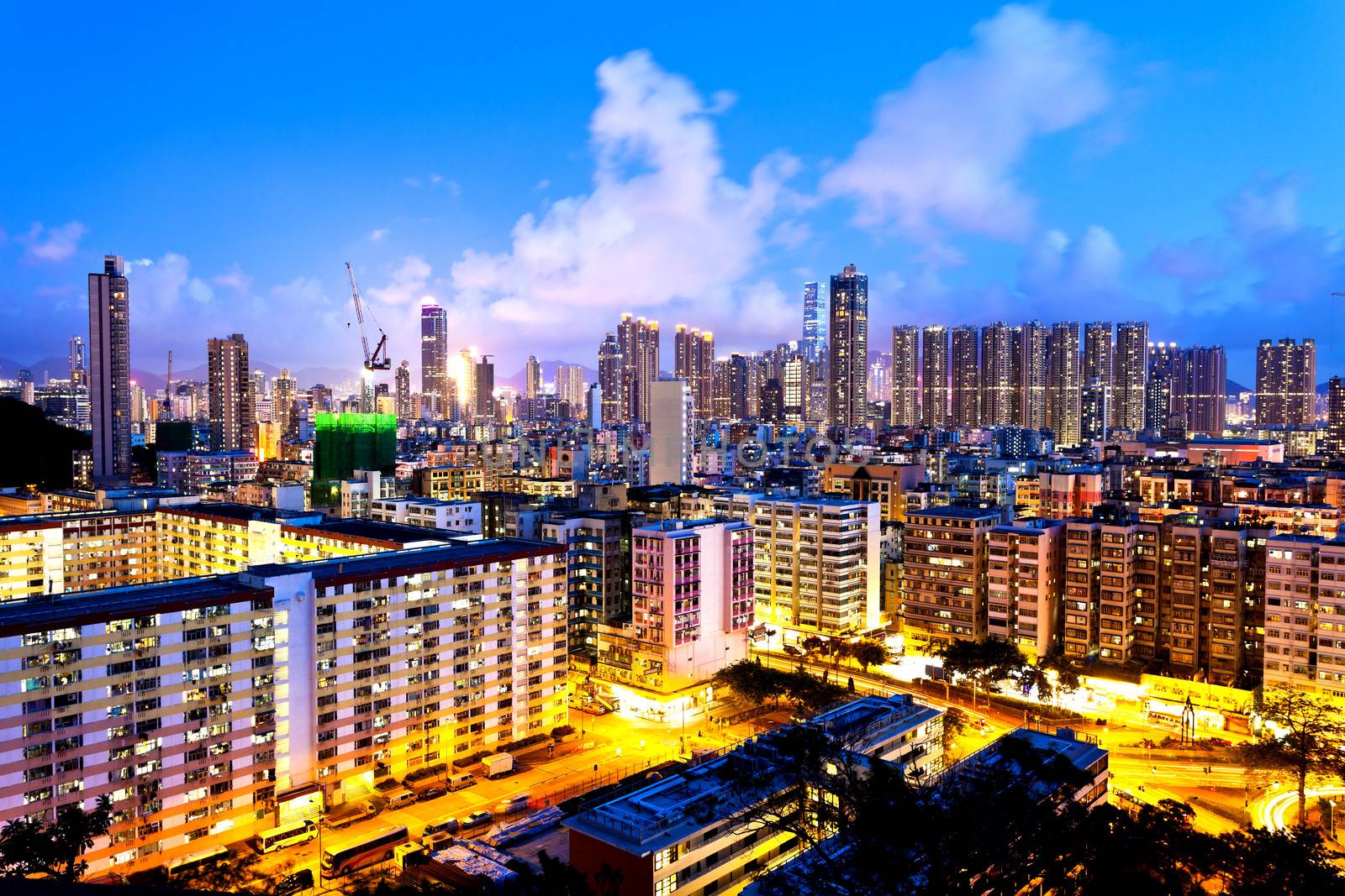 Hong Kong crowded urban at night by kawing921