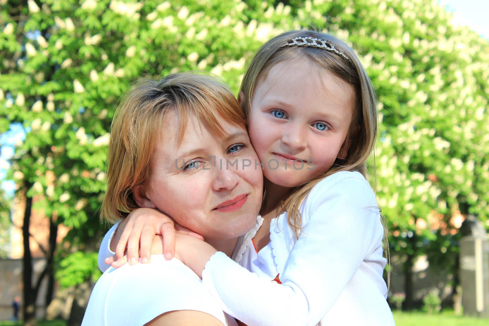 image of mother and daughter are hugging one another