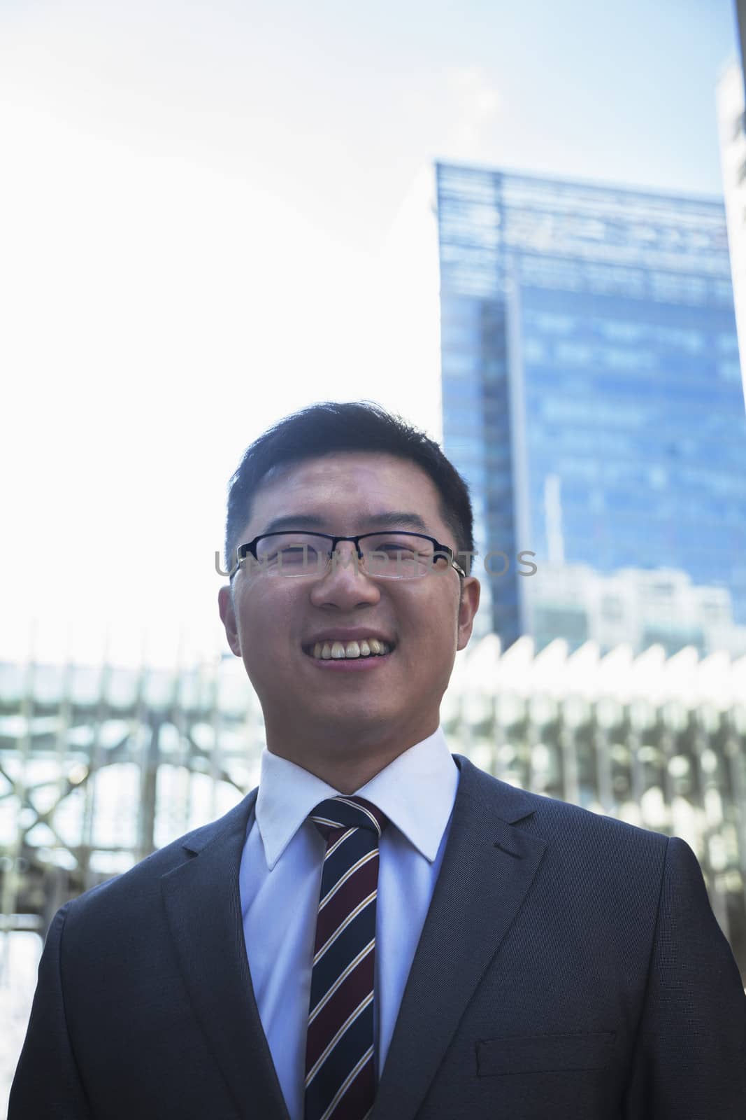 Portrait of smiling businessman outdoors in Beijing, China