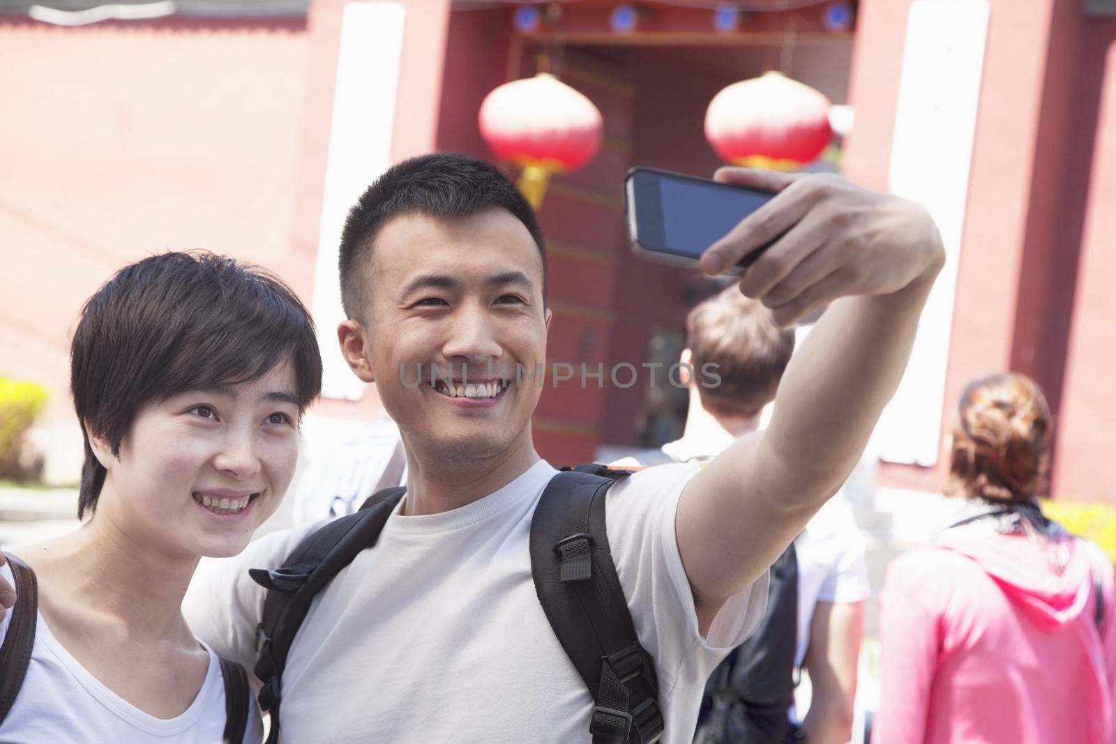 Young couple taking self portrait.