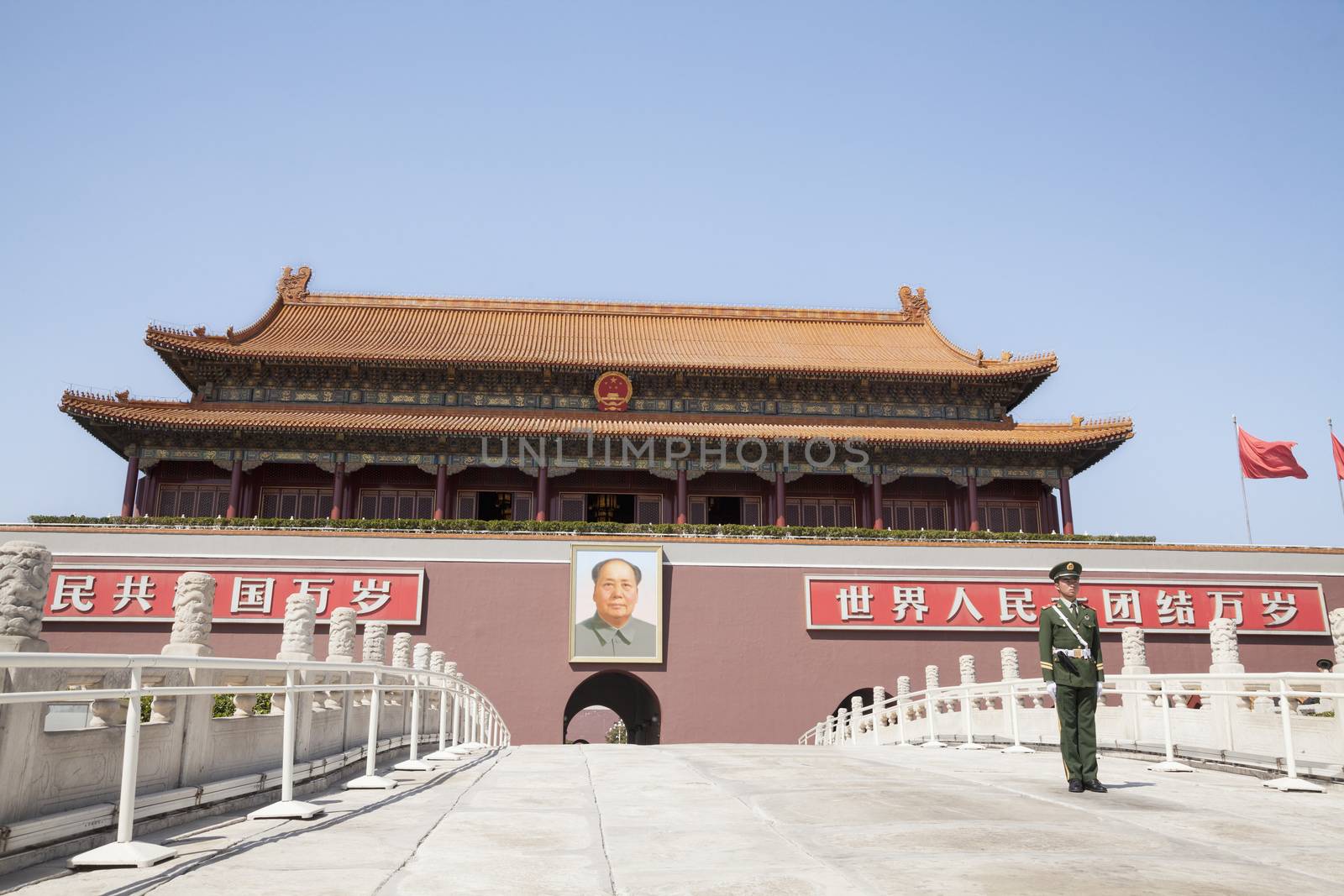 Tiananmen Square, Gate of Heavenly Peace with Mao's Portrait and guard, Beijing, China.