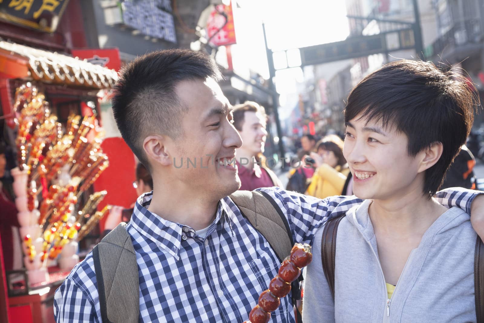 Young couple with candied haw. by XiXinXing