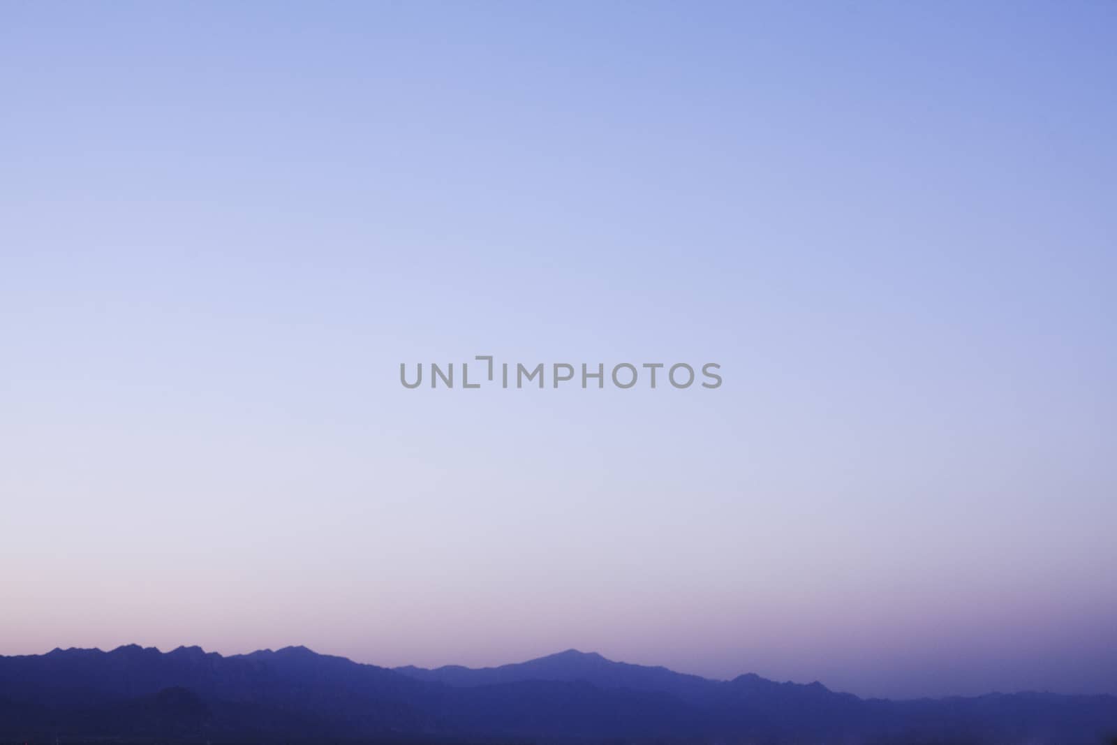 Landscape of mountain range and the sky at dusk, China