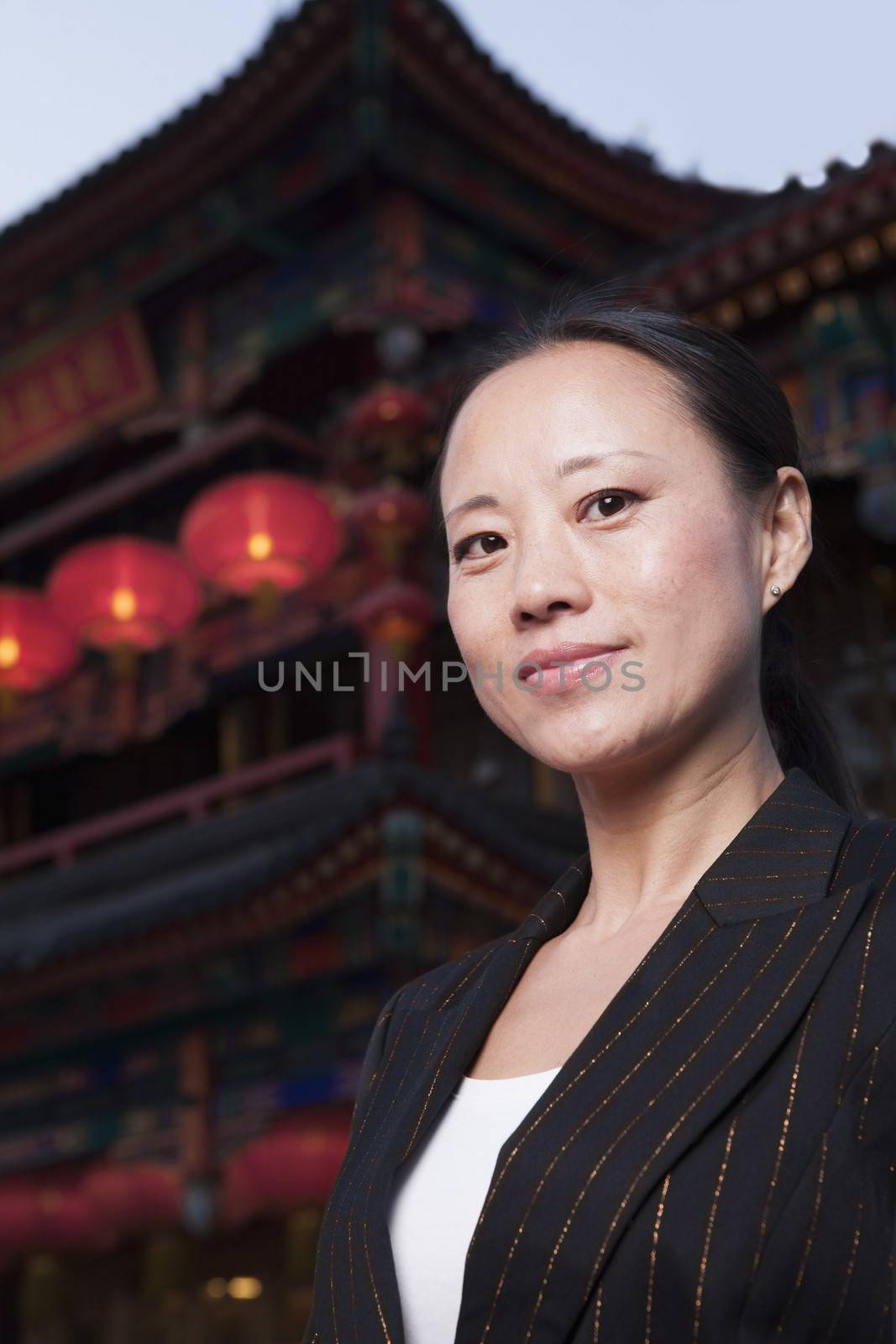 Portrait of businesswomen with Chinese architecture in background. by XiXinXing