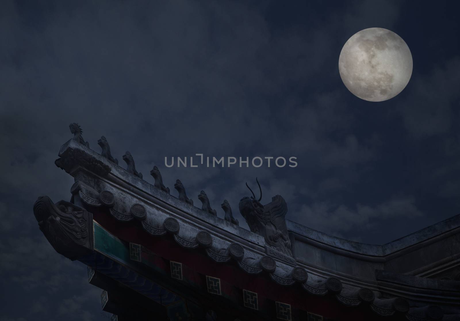 Close-up of ornate roof tiles on Chinese building with moon background, night. by XiXinXing