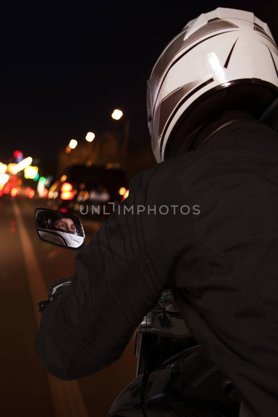 Young man riding a motorcycle through the streets of Beijing at night, rear view by XiXinXing