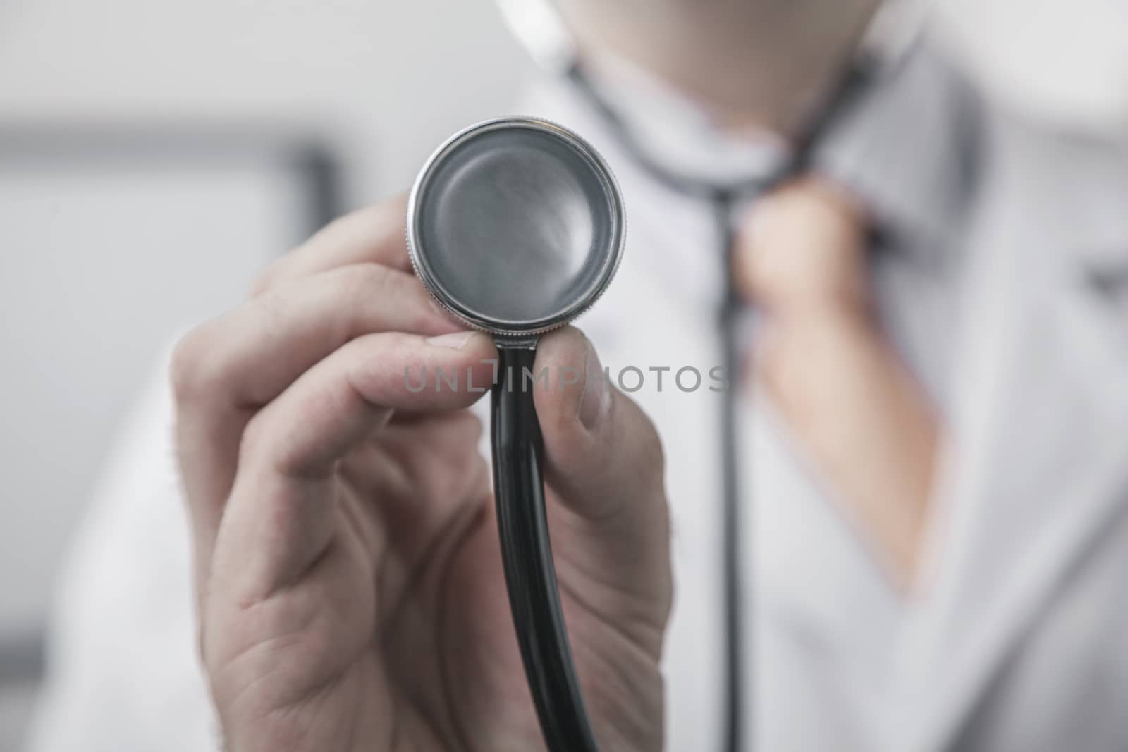 Close up of male doctor holding a stethoscope