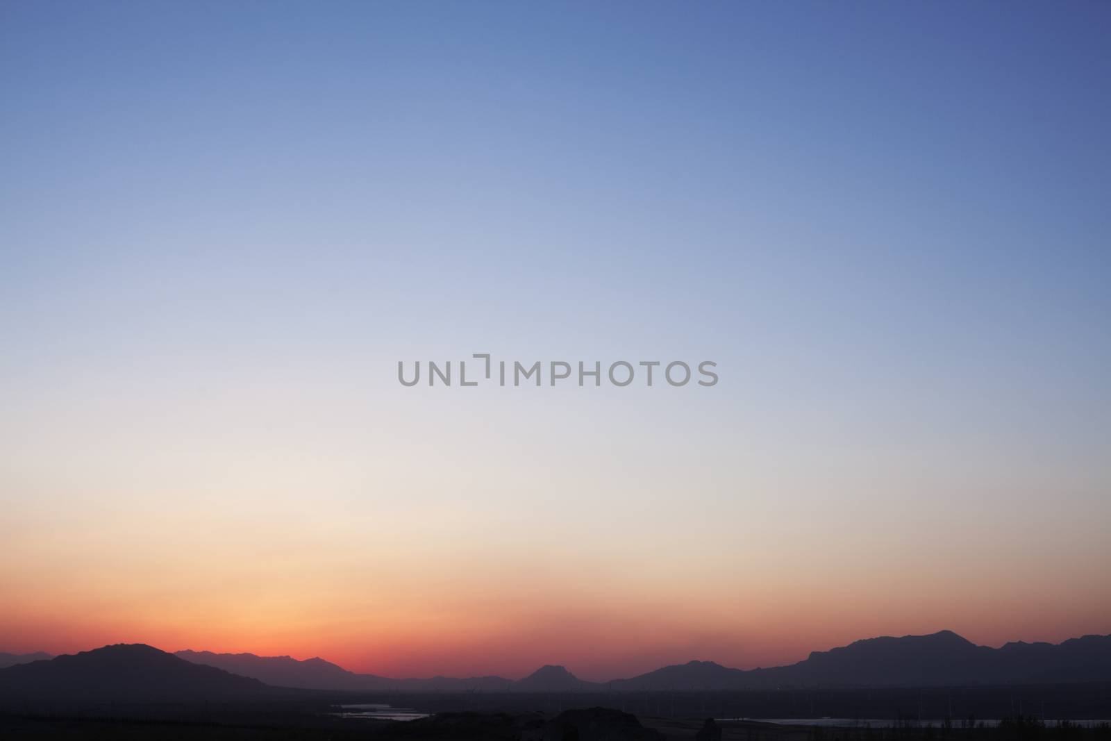 Landscape of mountain range and the sky at dusk, China