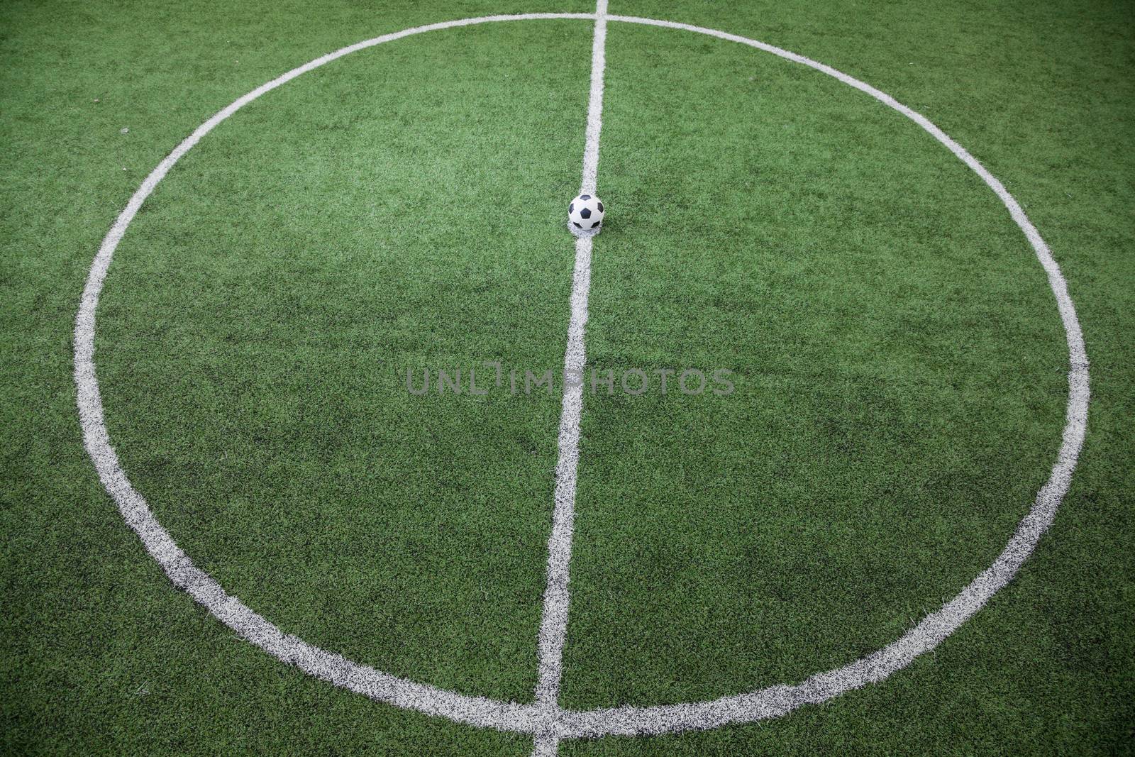 Soccer field with soccer ball on the line, high angle view by XiXinXing