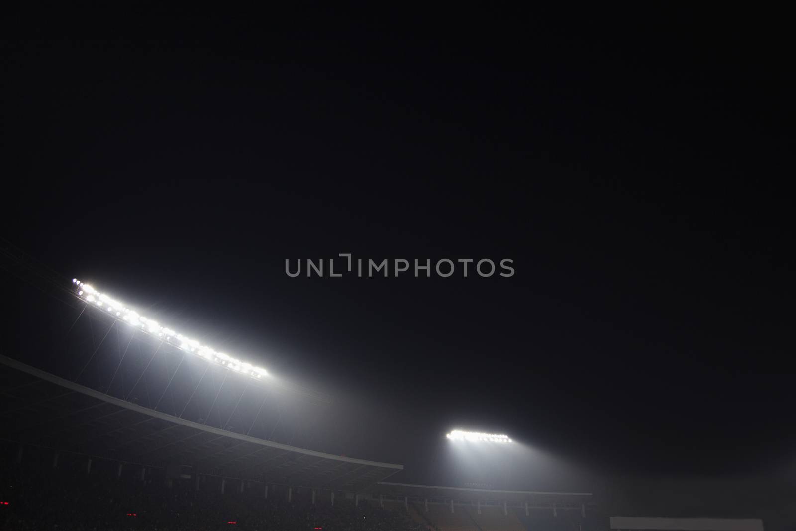 Stadium floodlights at night time, Beijing, China by XiXinXing