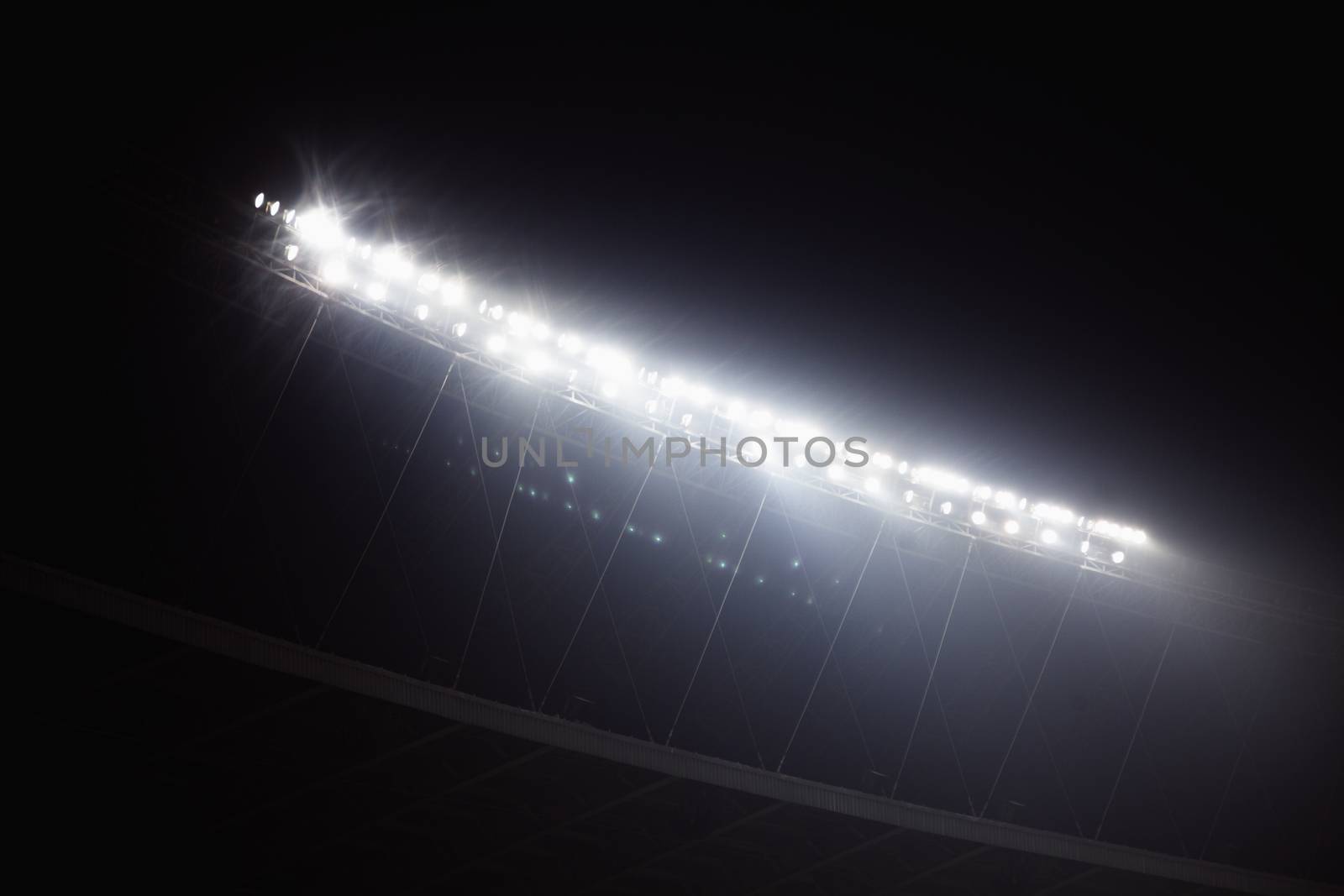 Stadium floodlights at night time, Beijing, China by XiXinXing