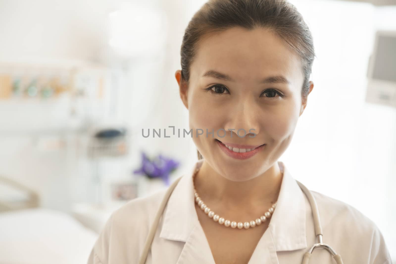 Portrait of smiling young female doctor in a hospital 