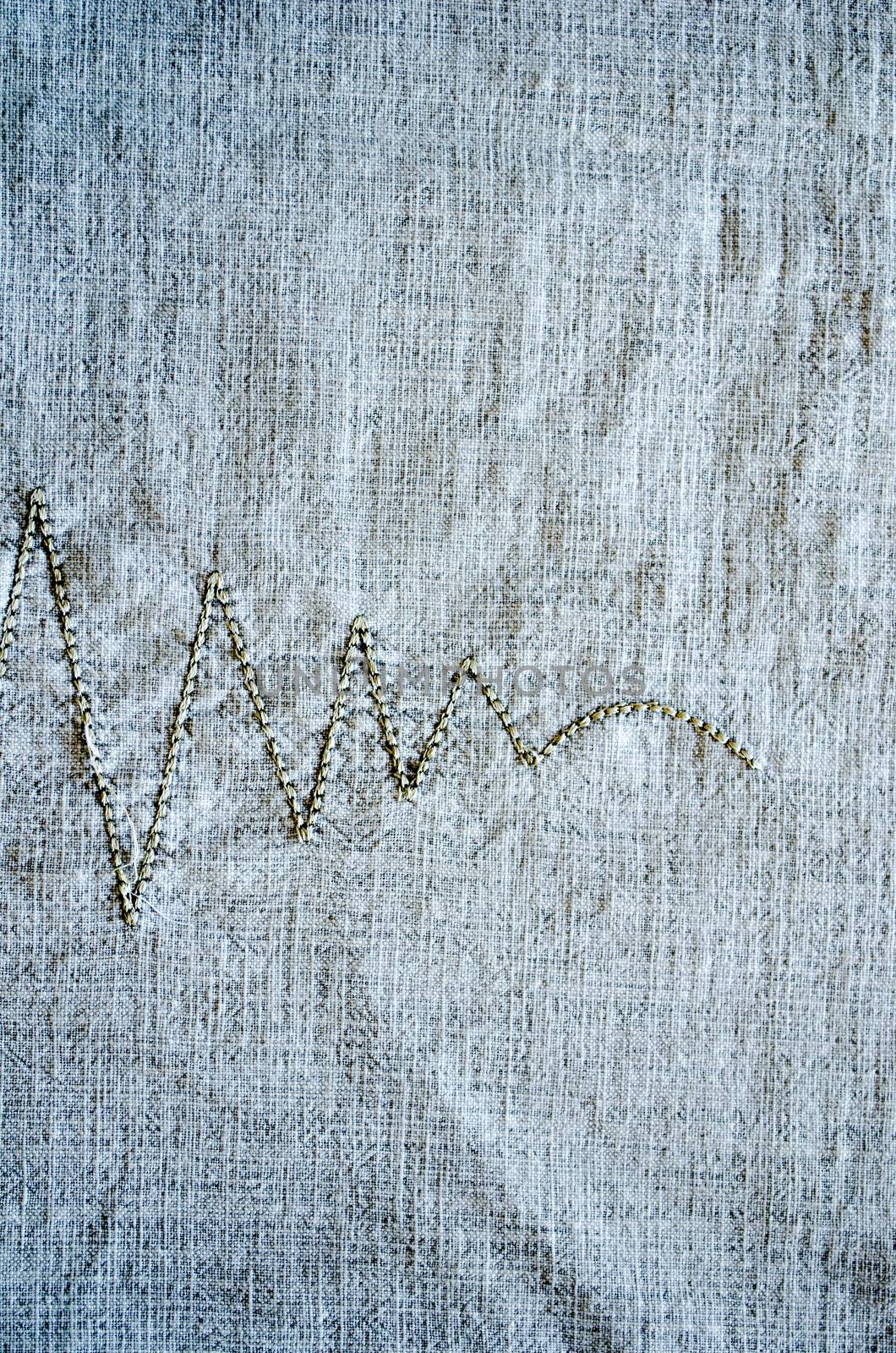 linen background embroider ornament closeup by sauletas