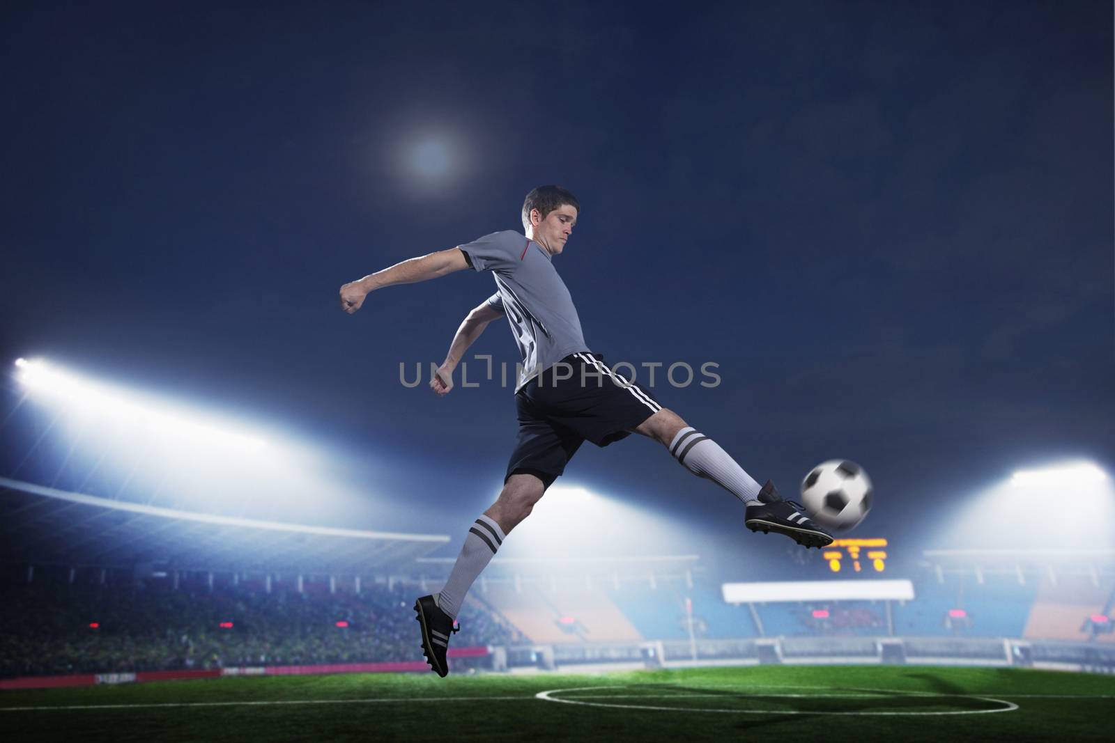 Soccer player in mid air kicking the soccer ball, stadium lights at night in background by XiXinXing