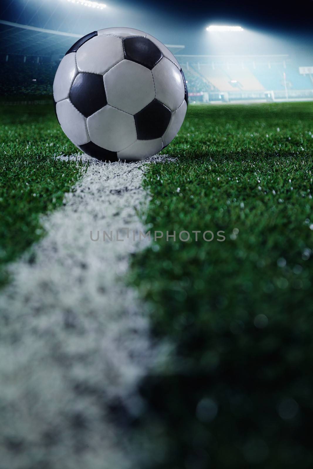 Soccer field with soccer ball and line, side view