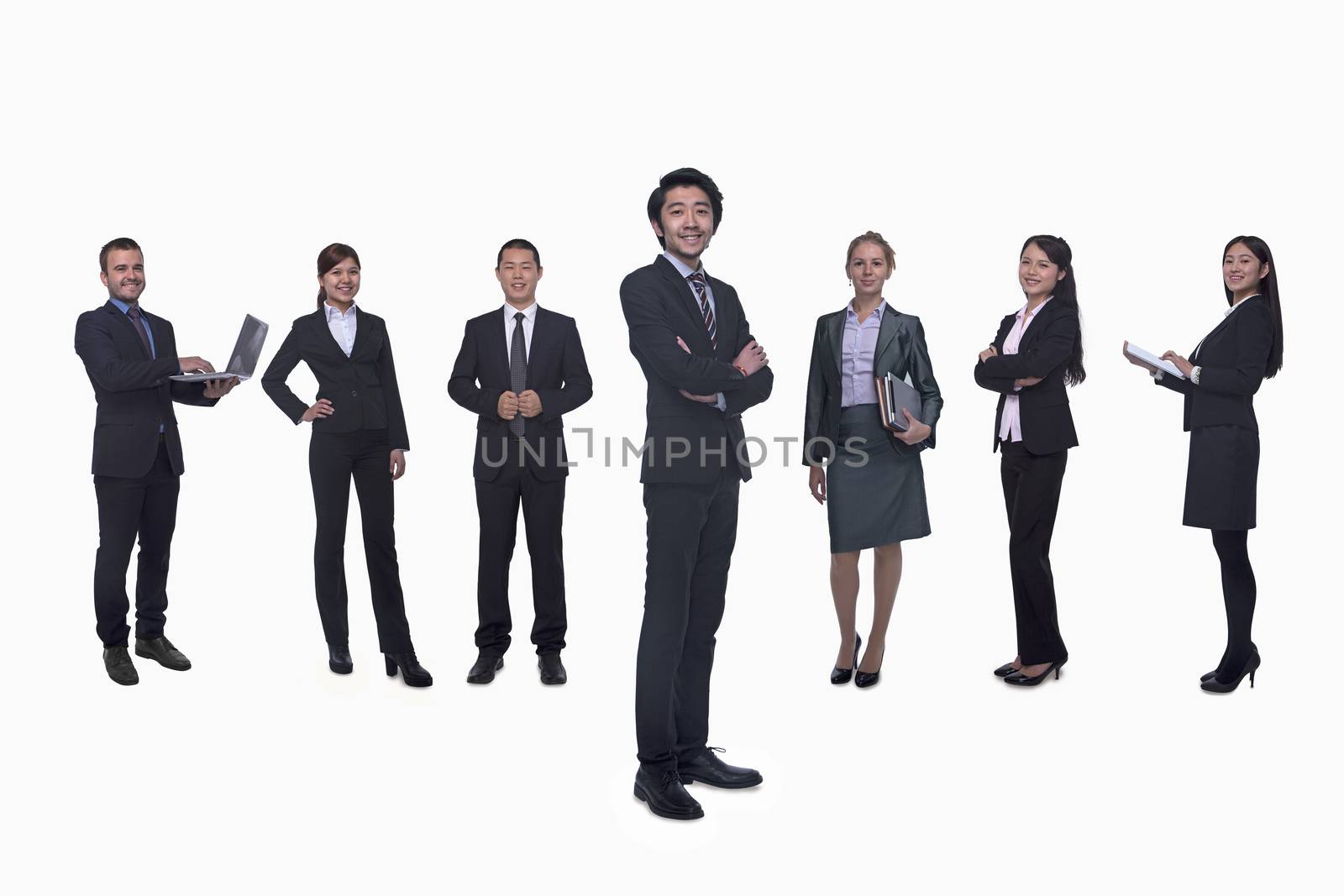 Medium group of business people in a row, portrait, full length, studio shot by XiXinXing