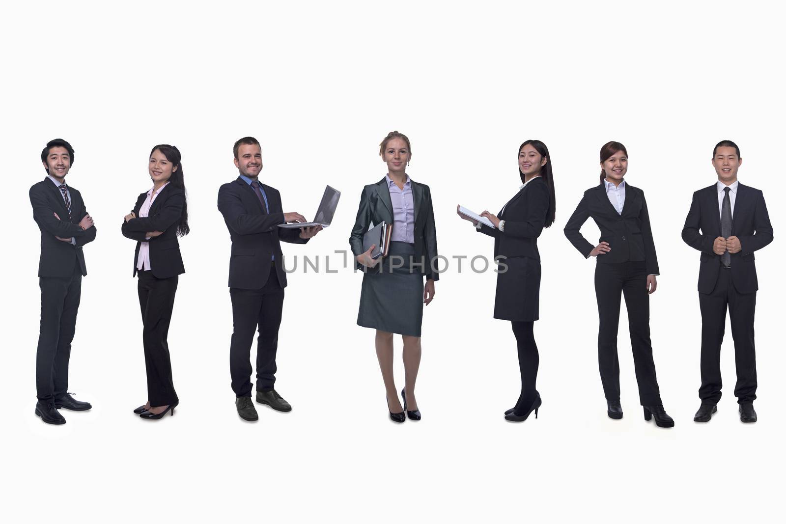 Medium group of business people in a row, portrait, full length, studio shot