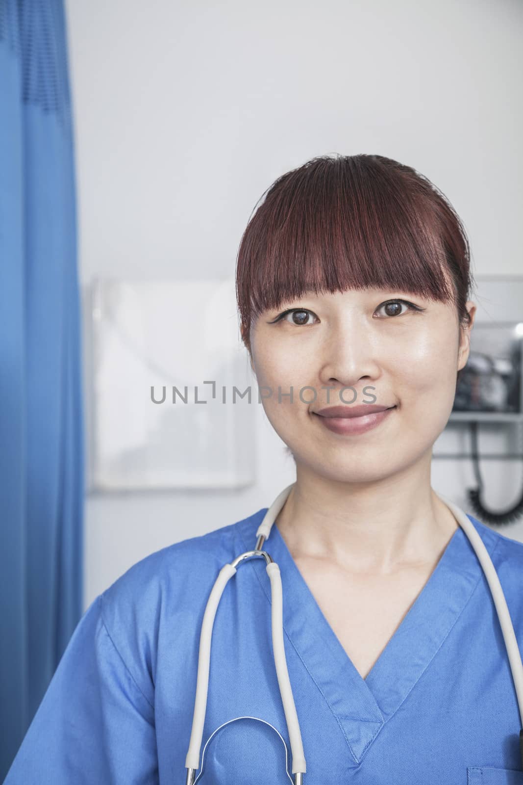 Portrait of smiling female doctor with a stethoscope