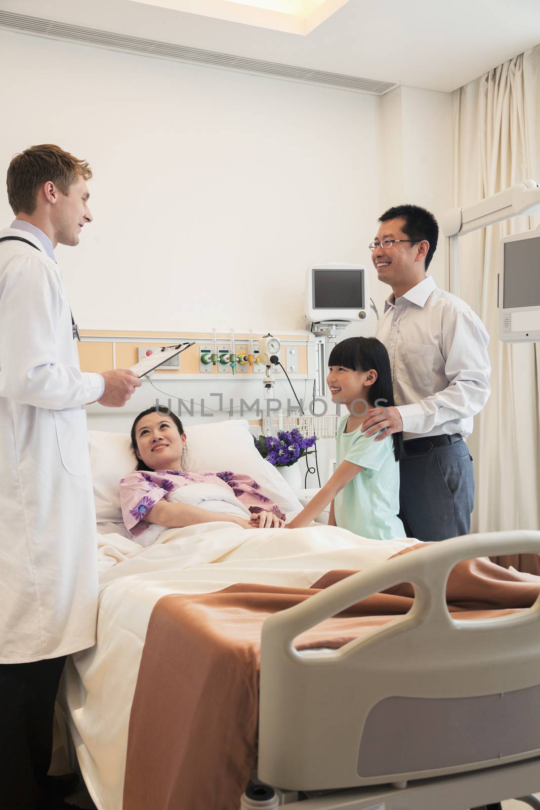 Family visiting the mother in the hospital, discussing with the doctor by XiXinXing