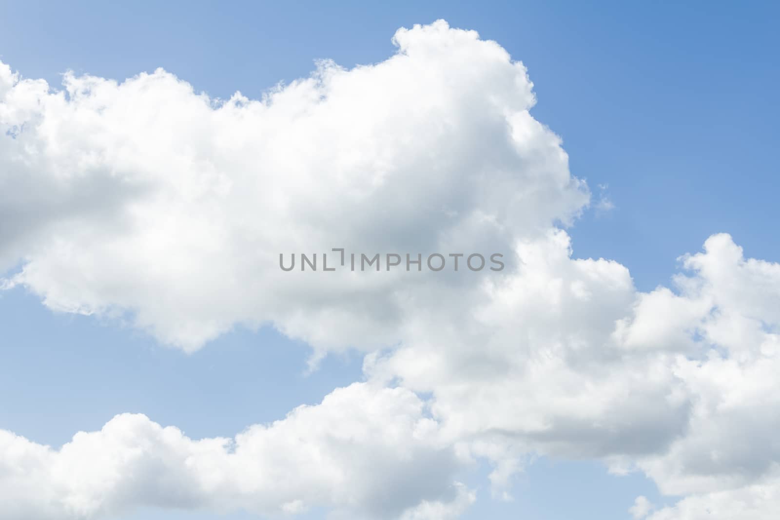 Closeup of blue sky with white clouds by doble.d