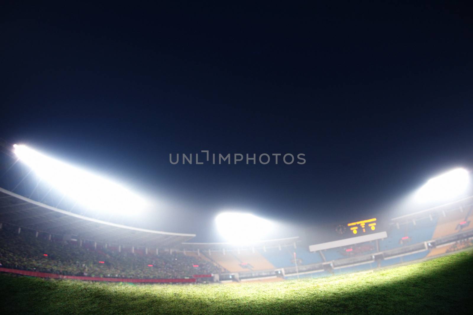 Digital composit of soccer field and night sky
