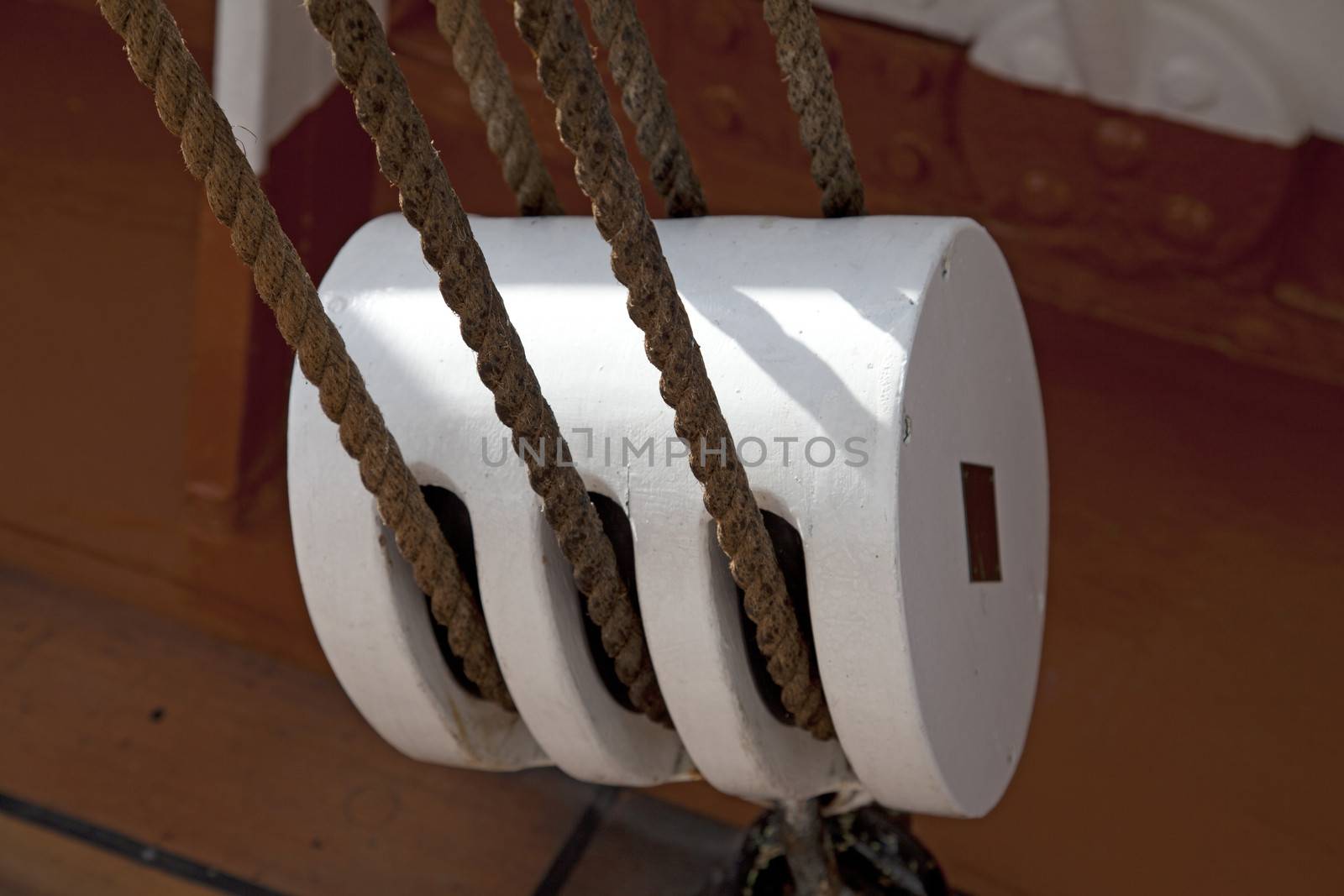 White sailboat block against dark red backround