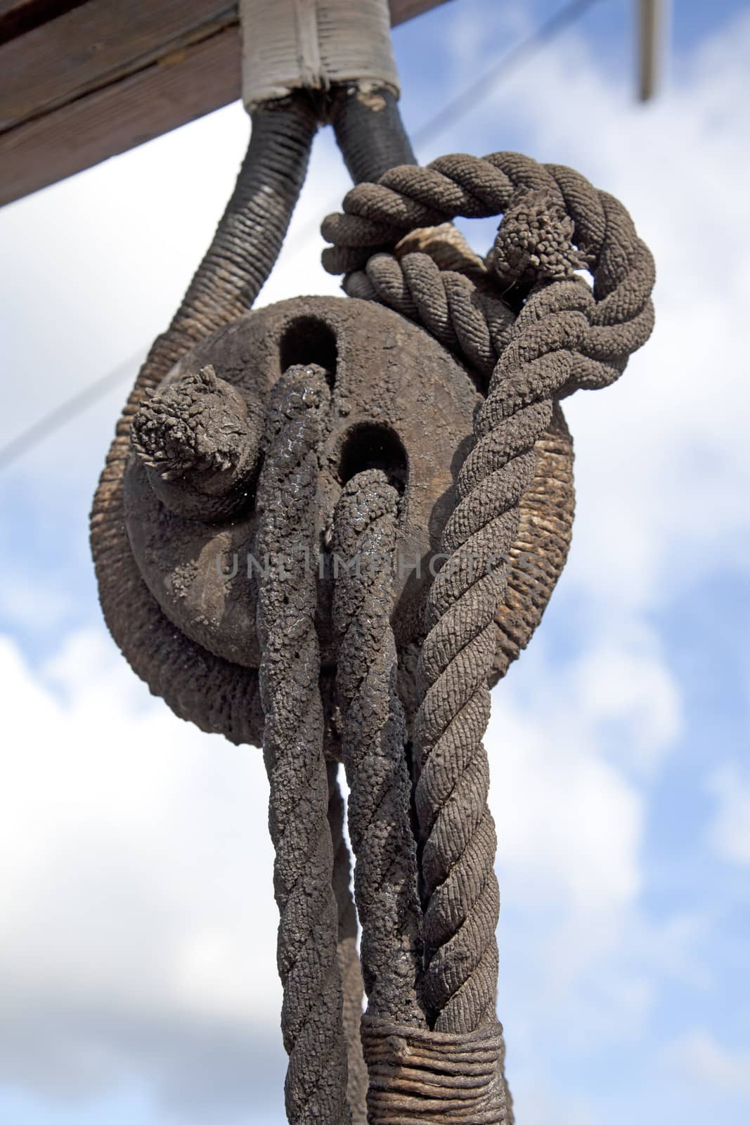 Sailboat wooden marine rigs and ropes. Nautical traditional tackle 