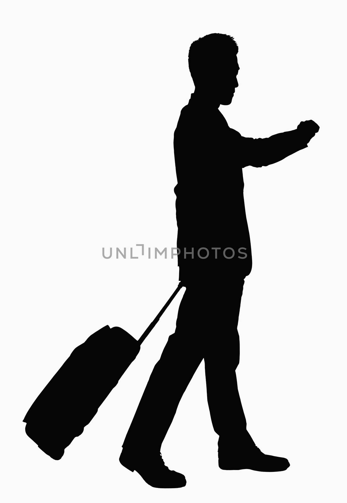 Silhouette of businessman checking wristwatch and pulling suitcase.